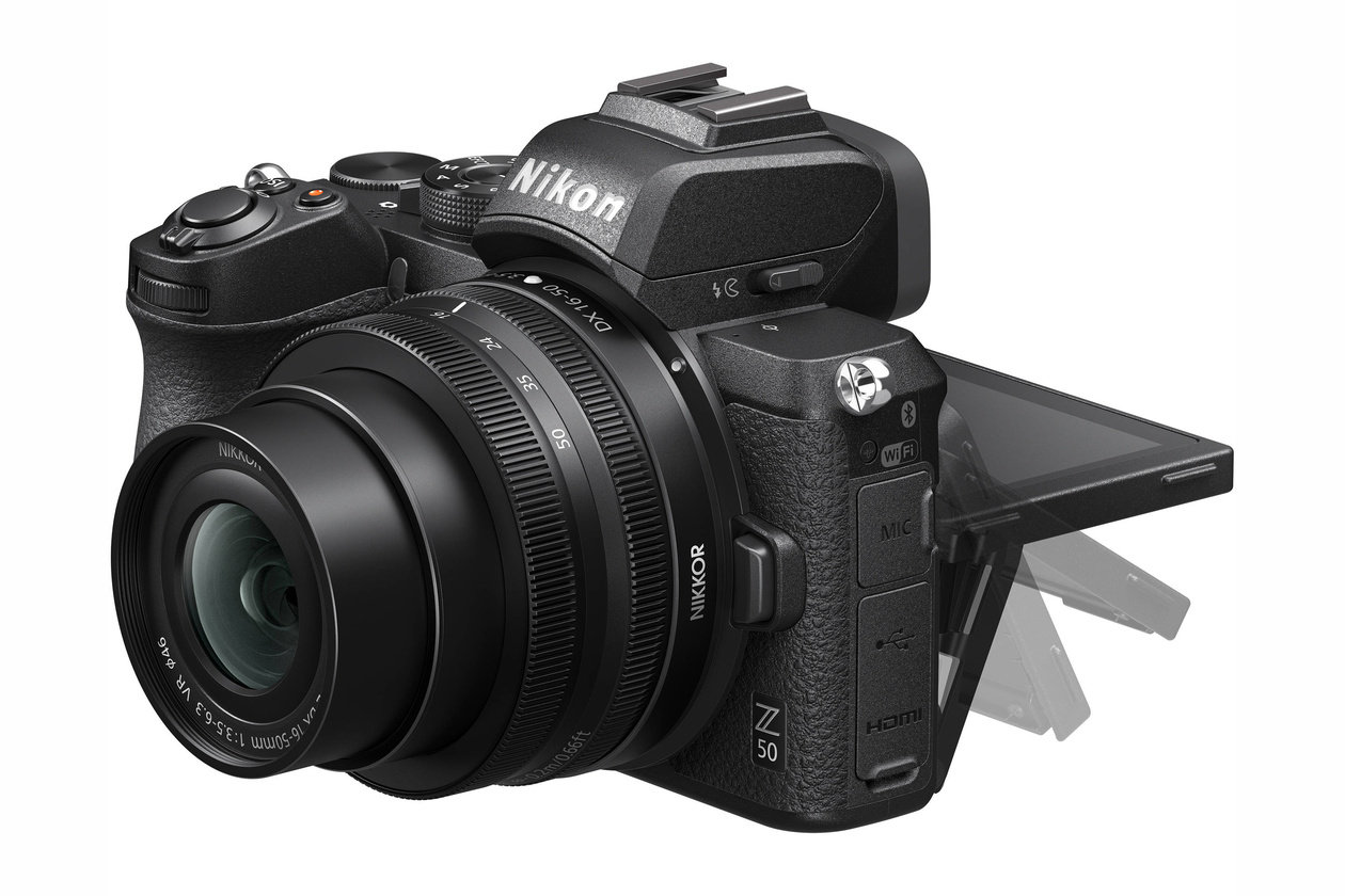 Nikon Z 50 APS-C mirrorless camera with a kit zoom lens and its screen flipped down