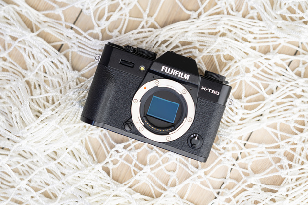 Fujifilm X-T30 body with the lens removed, showing its APS-C sensor