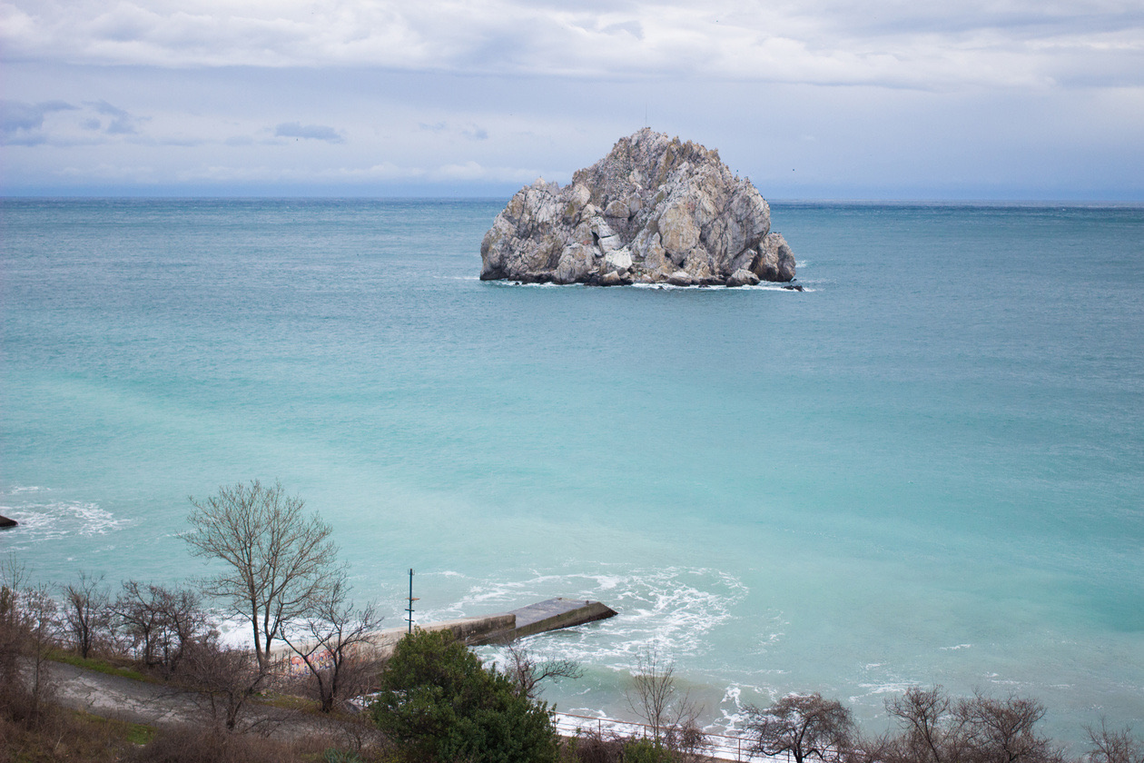 The same rock in the sea with correct exposure and natural turquoise water