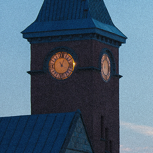 100 percent crop of the clock tower at ISO 6400, covered in grainy noise