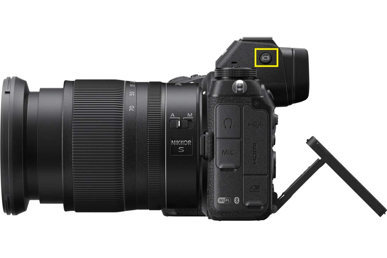 Side view of a mirrorless camera with a zoom lens and tilted screen, with the eye sensor next to the viewfinder highlighted