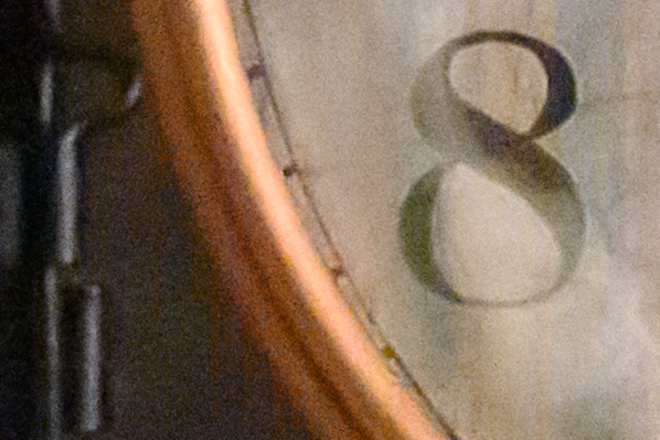 Crop of the alarm clock dial at base ISO, clean and detailed