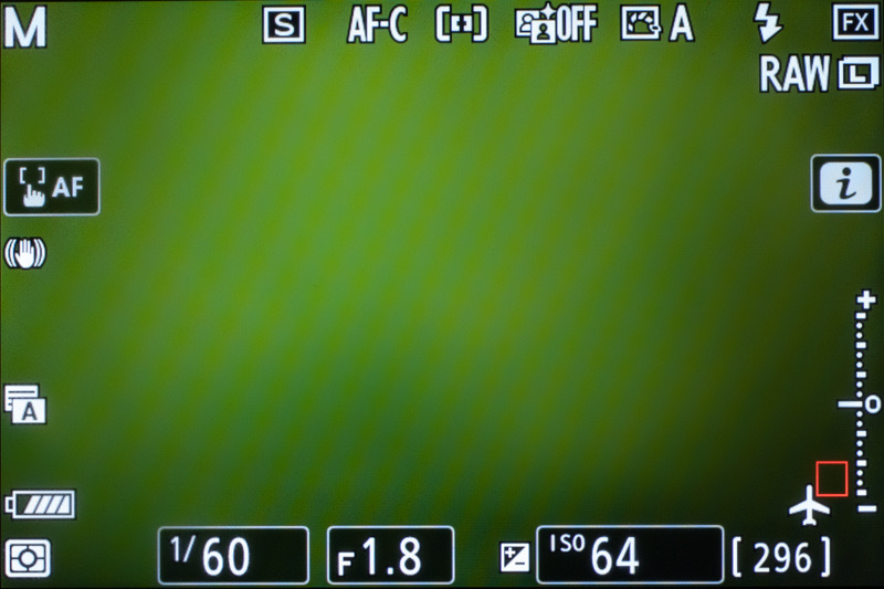 Mirrorless camera screen showing 1/60, F1.8 and ISO 64 along the bottom edge