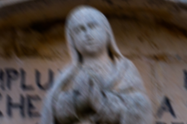The same stone statue smeared by camera shake